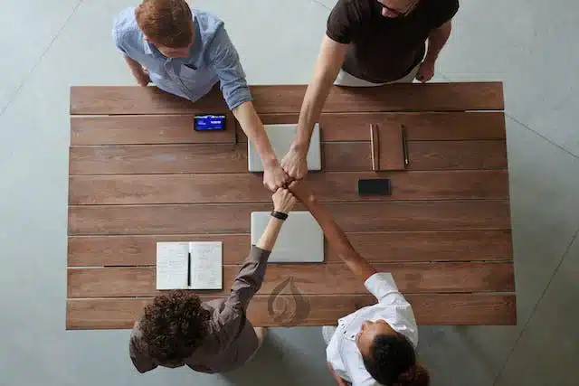 People putting hands together